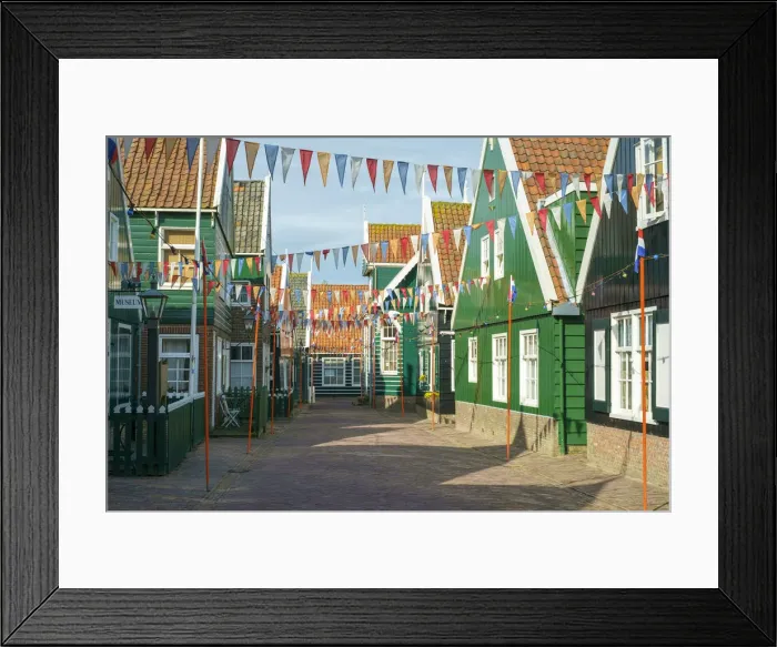 Framed Print : Streets of Marken decorated for Koningsdag, or Kings Day, with flags of Dutch Framed Print : Streets of Marken decorated for Koningsdag, or Kings Day, with flags of Dutch