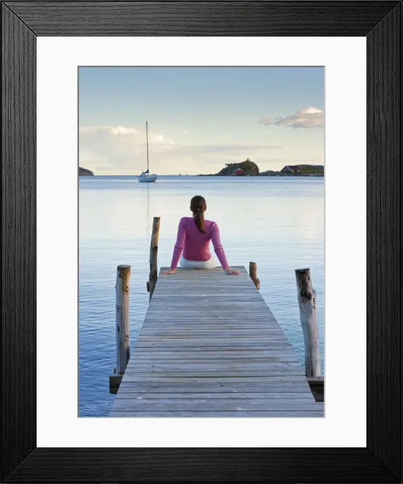 Framed Print : Norway, Oslo, Oslo Fjord, Woman sitting on jetty over lake (MR) Framed Print : Norway, Oslo, Oslo Fjord, Woman sitting on jetty over lake (MR)