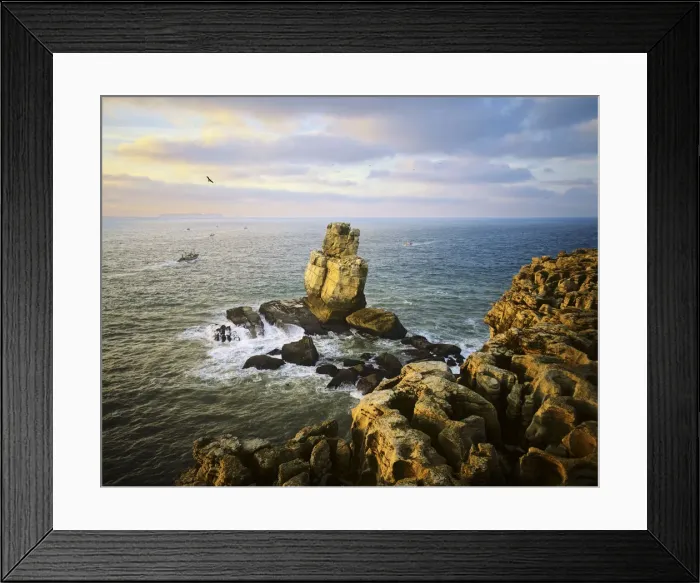 Framed Print : Nau dos Corvos and Carvoeiro cape, at sunset, with fishing boats going to work