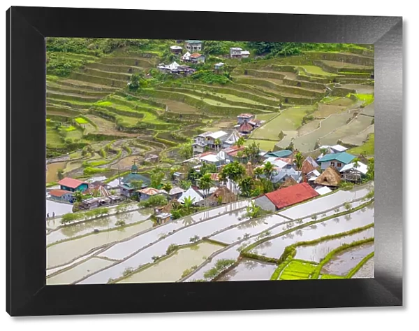 Batad village and flooded rice fields during early spring rice planting season, Banaue