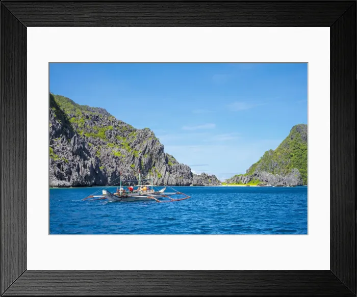 Framed Print : Outrigger boat passing Tapiutan Island, El Nido, Palawan, Philippines Framed Print : Outrigger boat passing Tapiutan Island, El Nido, Palawan, Philippines