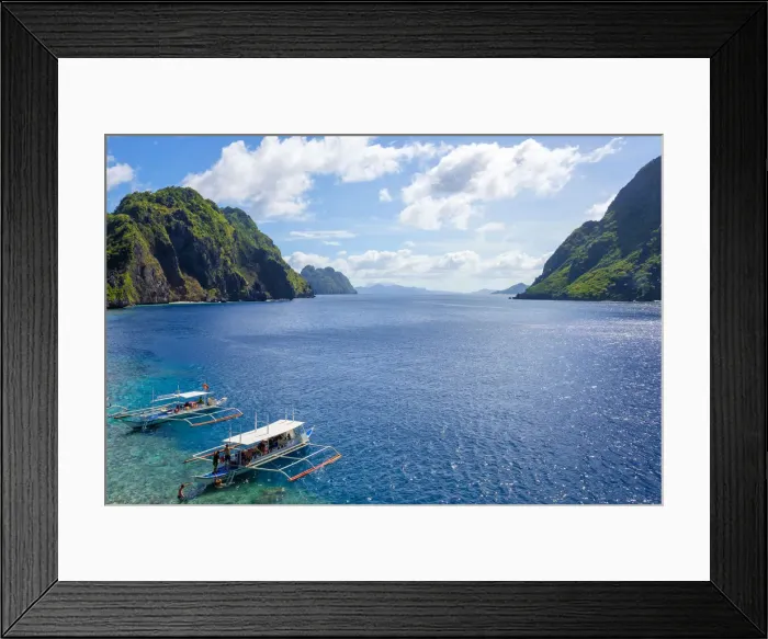 Framed Print : Outrigger boats anchored at Matinloc Island on the Tapiutan Strait between Tapiutan Framed Print : Outrigger boats anchored at Matinloc Island on the Tapiutan Strait between Tapiutan