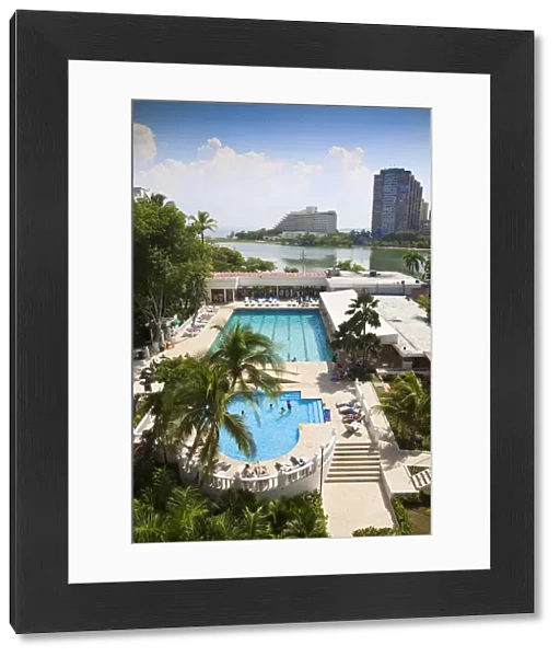 Colombia, Bolivar, Cartagena De Indias, Bocagrande, Hotel swimming pool with Hilton