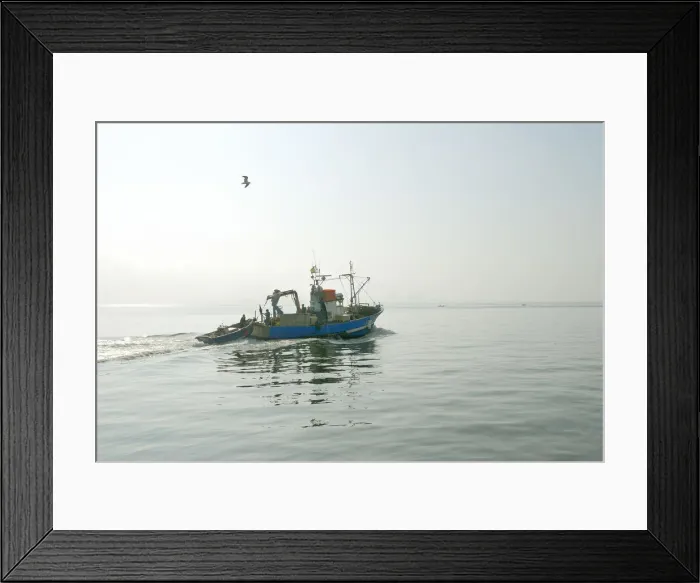 Framed Print : Fishing boat in a foggy morning going to the sea. Setubal, Portugal Framed Print : Fishing boat in a foggy morning going to the sea. Setubal, Portugal
