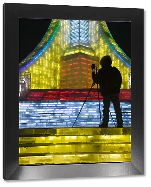 China, Heilongjiang, Harbin, Ice and Snow Festival, Photographer Silhouette at Ice