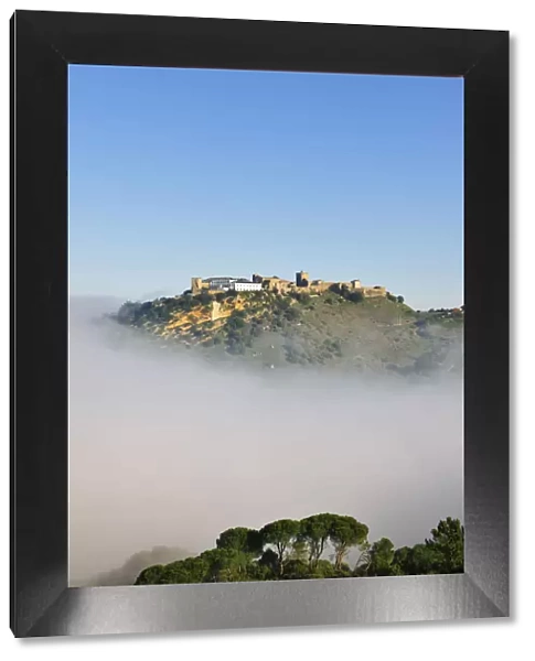 Palmela medieval castle in a misty morning. Portugal