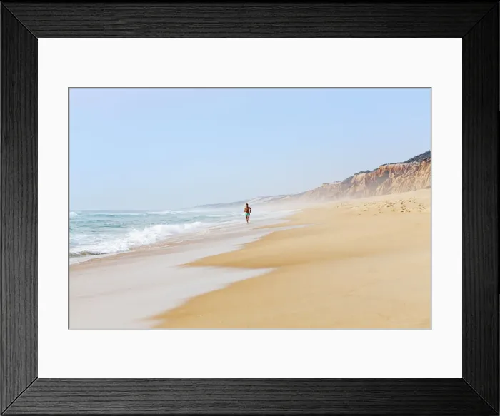 Framed Print : Europe, Portugal, Alentejo, Grandola, a man running along Praia da Gale beach near Framed Print : Europe, Portugal, Alentejo, Grandola, a man running along Praia da Gale beach near
