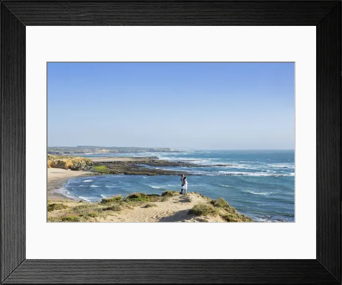 Framed Print : Europe, Portugal, Alentejo, Vila Nova de Milfontes, a young couple on praia carreiro Framed Print : Europe, Portugal, Alentejo, Vila Nova de Milfontes, a young couple on praia carreiro