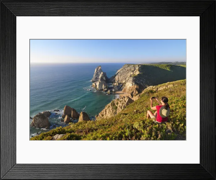Framed Print : Portugal, Estramadura, Ursa woman sitting on cliff edge (MR) Framed Print : Portugal, Estramadura, Ursa woman sitting on cliff edge (MR)