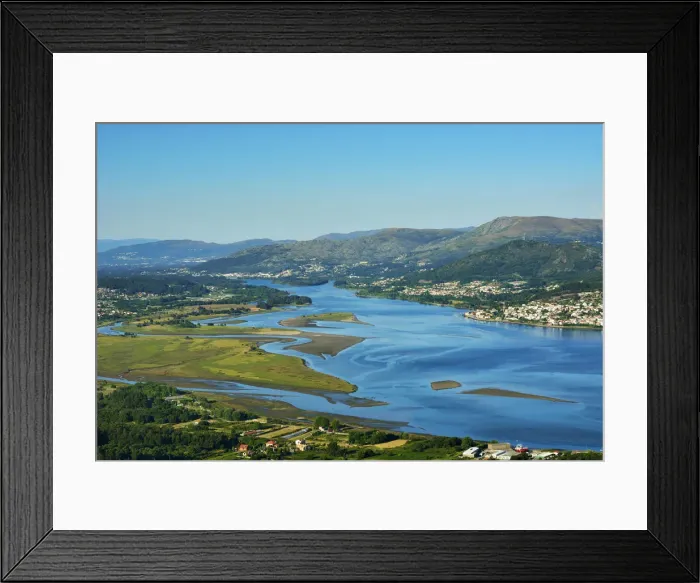 Framed Print : Minho river between Portugal and Spain. Portugal on the background and spanish Galicia Framed Print : Minho river between Portugal and Spain. Portugal on the background and spanish Galicia