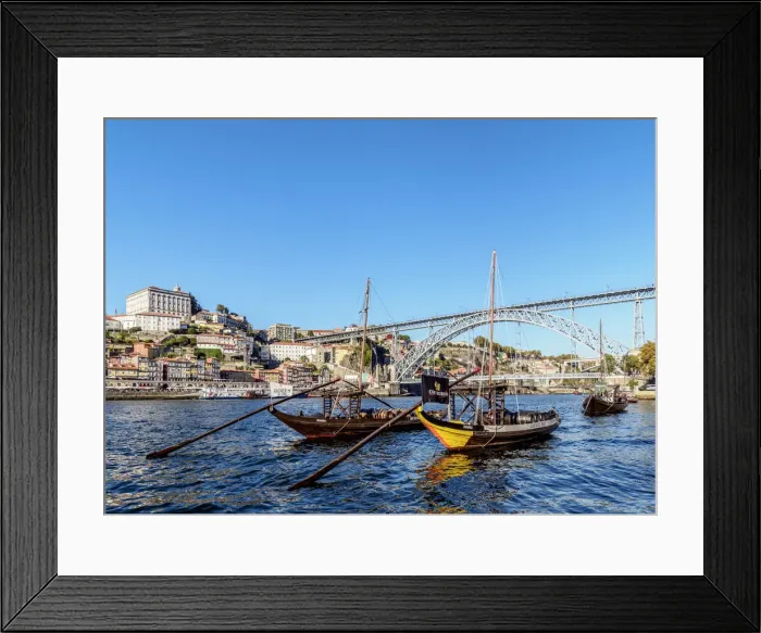 Framed Print : Traditional boats on Vila Nova de Gaia bank of Douro River, Dom Luis I Bridge in Framed Print : Traditional boats on Vila Nova de Gaia bank of Douro River, Dom Luis I Bridge in