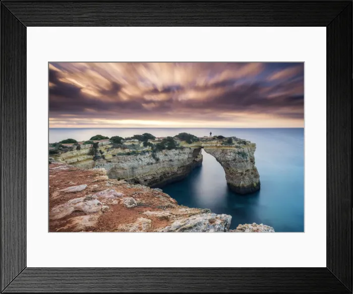 Framed Print : Person on Natural Sea Arch, Praia da Albandeira, Algarve, Portugal Framed Print : Person on Natural Sea Arch, Praia da Albandeira, Algarve, Portugal