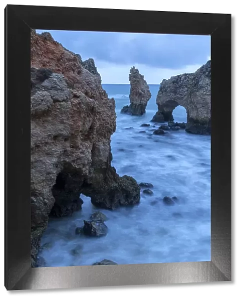 Portugal, Algarve, Lagos, Sea stacks and arch on coast