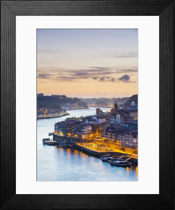 Framed Print : Portugal, Douro Litoral, Porto. Dusk in the UNESCO listed Ribeira district, viewed Framed Print : Portugal, Douro Litoral, Porto. Dusk in the UNESCO listed Ribeira district, viewed