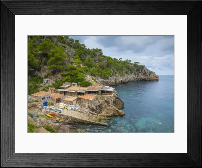 Framed Print : Waterside restaurant, Cala De Deia, Serra de Tramuntana (a location in the BBC drama Framed Print : Waterside restaurant, Cala De Deia, Serra de Tramuntana (a location in the BBC drama