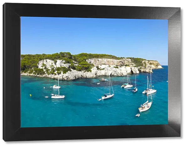 Elevated view over the idyllic bay  /  beach of Cala Macarelleta, Menorca, Balearic Islands