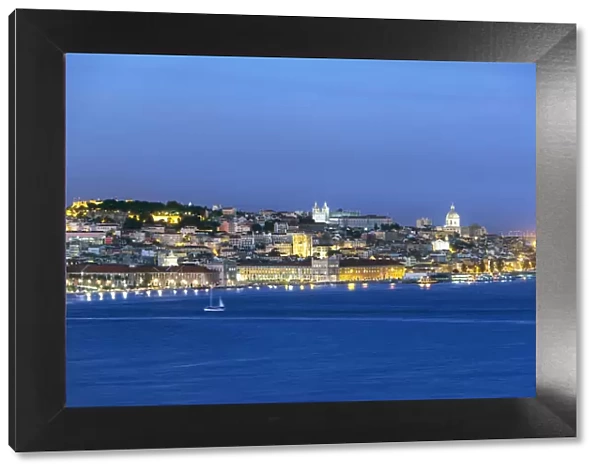 The Tagus river (Tejo river) and the historic centre of Lisbon at twilight. Portugal