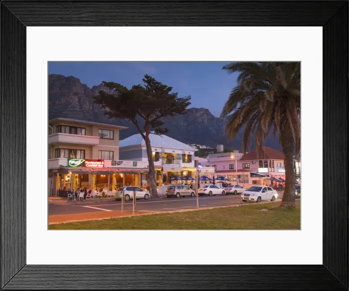 Framed Print : Restaurants in Camps Bay at dusk, Cape Town, Western Cape, South Africa Framed Print : Restaurants in Camps Bay at dusk, Cape Town, Western Cape, South Africa