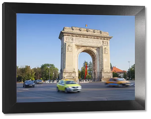 Traffic passing Arch of Triumph, Bucharest, Romania