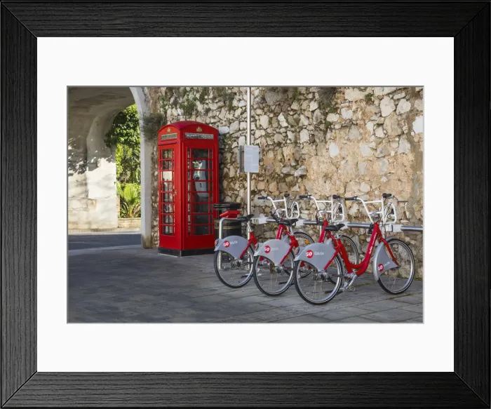 Framed Print : Gibraltar, Gibraltar, British red telephone box and hire bikes by Southport Gates Framed Print : Gibraltar, Gibraltar, British red telephone box and hire bikes by Southport Gates