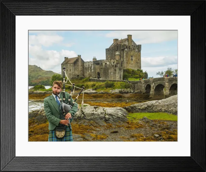 Framed Print : UK, Scotland, Highlands, Dornie, Man in Highland Dress playing bigpipe in front of Framed Print : UK, Scotland, Highlands, Dornie, Man in Highland Dress playing bigpipe in front of