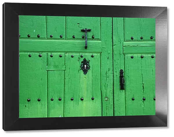 Green traditional door. Castrillo de los Polvazares, Castilla y Leon, Spain