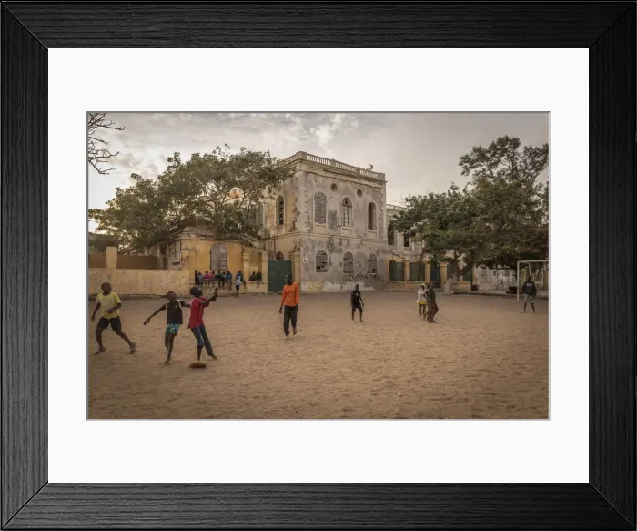 Framed Print : Africa, Senegal, Dakar. children playing football at sunset on the island Gora e Framed Print : Africa, Senegal, Dakar. children playing football at sunset on the island Gora e