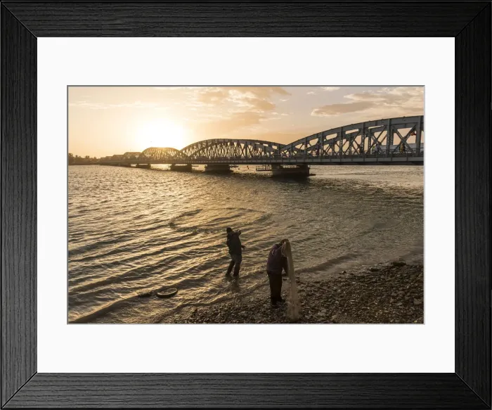 Framed Print : Africa, Senegal, Saint-Louis. Fishermen with nets at the Faidherbe bridge Framed Print : Africa, Senegal, Saint-Louis. Fishermen with nets at the Faidherbe bridge