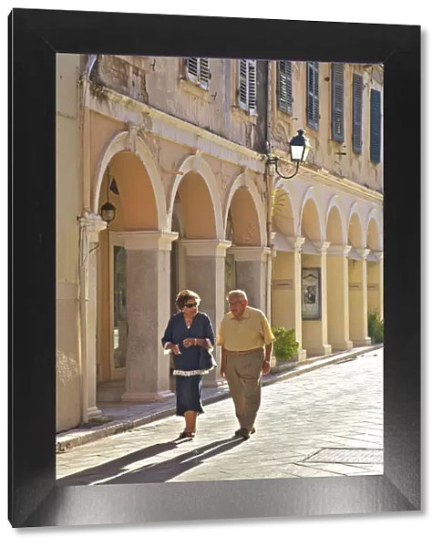 Couple Walking Through Corfu Old Town, Corfu, The Ionian Islands, Greek Islands, Greece