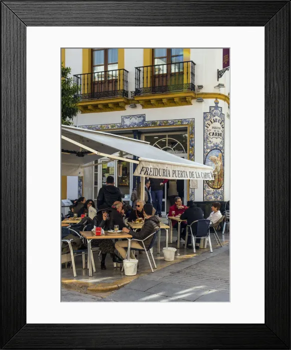Framed Print : Tourists seated at tables outside a tapas bar in Seville, Andalusia, Spain Framed Print : Tourists seated at tables outside a tapas bar in Seville, Andalusia, Spain