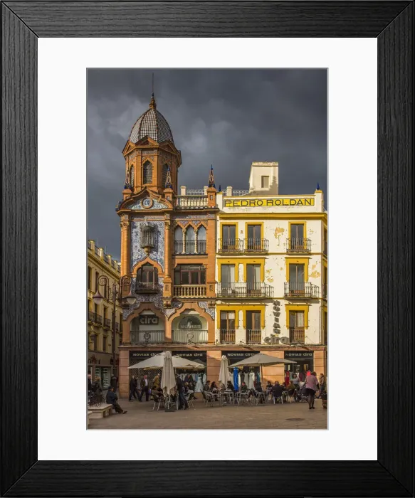Framed Print : Small square with outdoor cafe in Seville, Andalusia, Spain Framed Print : Small square with outdoor cafe in Seville, Andalusia, Spain