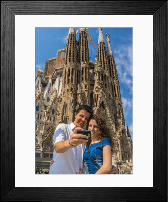 Framed Print : Caucasian young couple taking photo of themselves in front of Sagrada Familia church Framed Print : Caucasian young couple taking photo of themselves in front of Sagrada Familia church