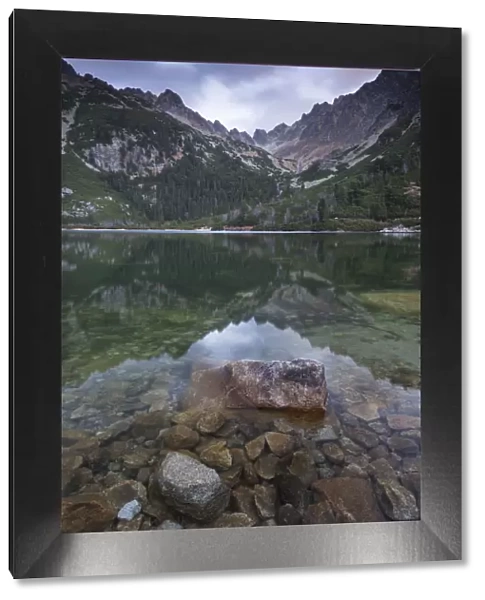 A mirror still Popradske Pleso lake in the High Tatras, Slovakia, Europe. Autumn