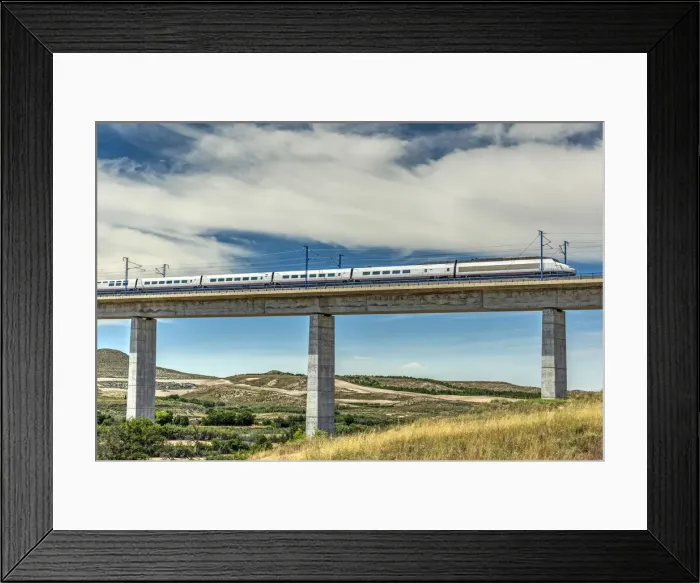 Framed Print : The Madrid-Barcelona AVE high-speed passenger train while is crossing a viaduct, Fuentes