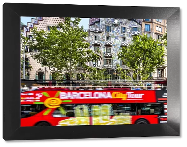 Sightseeing bus in front of Casa Batllo, Barcelona, Catalonia, Spain
