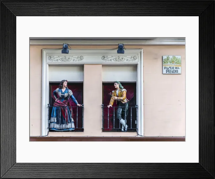 Framed Print : Man and woman sculptures with traditional Spanish dressed on the balconies, Paseo