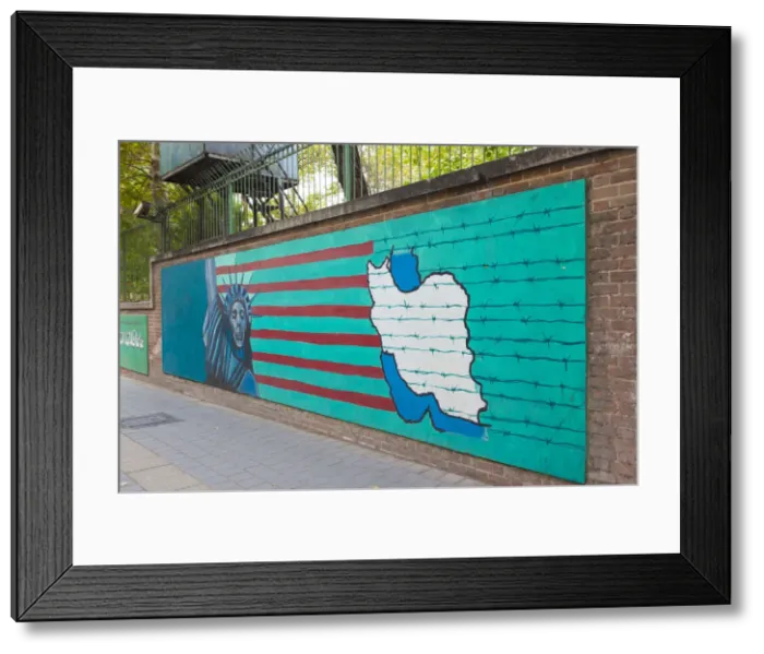 Framed Print : Iran, Tehran, anti-US propaganda mural on the outer walls of the former US embassy Framed Print : Iran, Tehran, anti-US propaganda mural on the outer walls of the former US embassy
