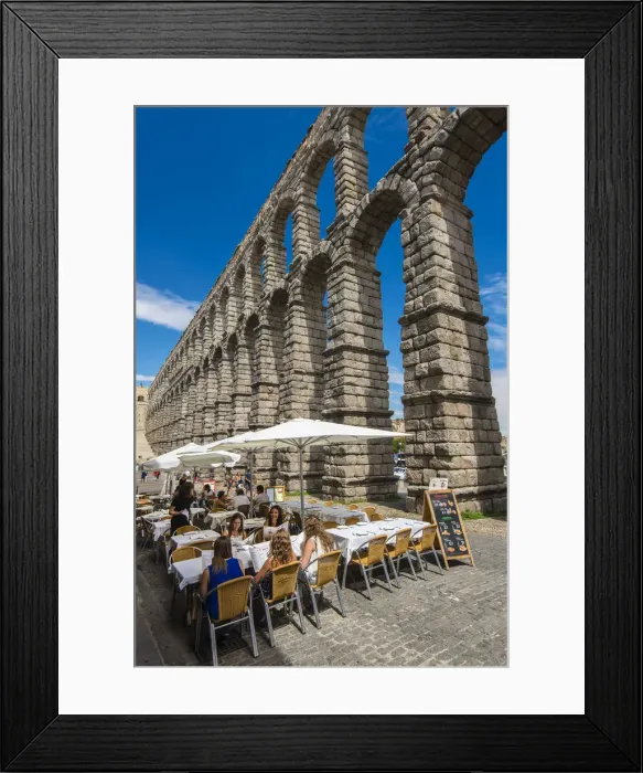 Framed Print : Outdoor restaurant with Roman aqueduct bridge behind, Segovia, Castile and Leon, Spain Framed Print : Outdoor restaurant with Roman aqueduct bridge behind, Segovia, Castile and Leon, Spain