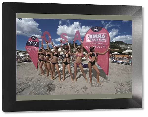 Promotion teams of the big clubs advertise in front of the Sa Trinxa- Beach Bar, Platja