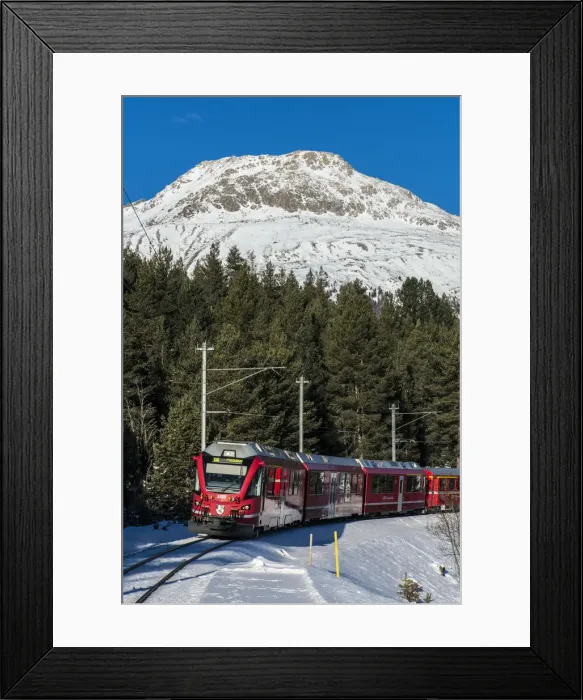 Framed Print : Winter view of the famous Bernina Express red train near Pontresina, Graubunden Framed Print : Winter view of the famous Bernina Express red train near Pontresina, Graubunden