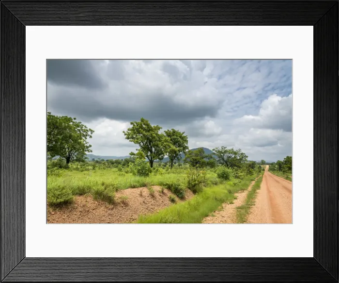 Framed Print : Africa, Togo, Koutammakou area. Landscape with gravel road of a rural area Framed Print : Africa, Togo, Koutammakou area. Landscape with gravel road of a rural area