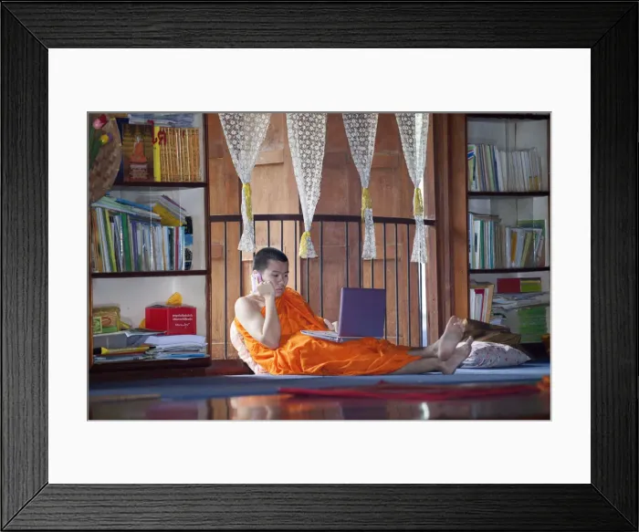 Framed Print : South East Asia, Thailand, Buddhist monk using a lap top and a mobile phone Framed Print : South East Asia, Thailand, Buddhist monk using a lap top and a mobile phone