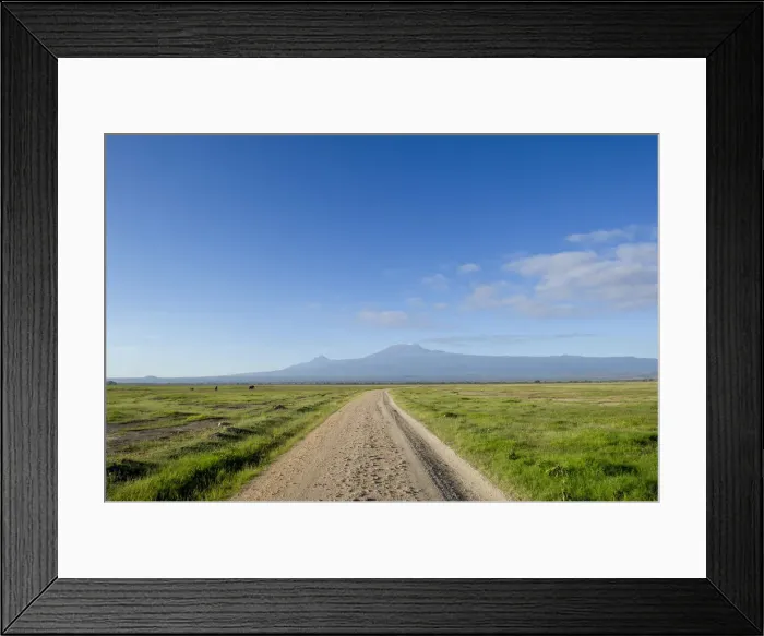 Framed Print : The Road to Mount Kilimanjaro. A road in the Amboseli National Park, looking towards