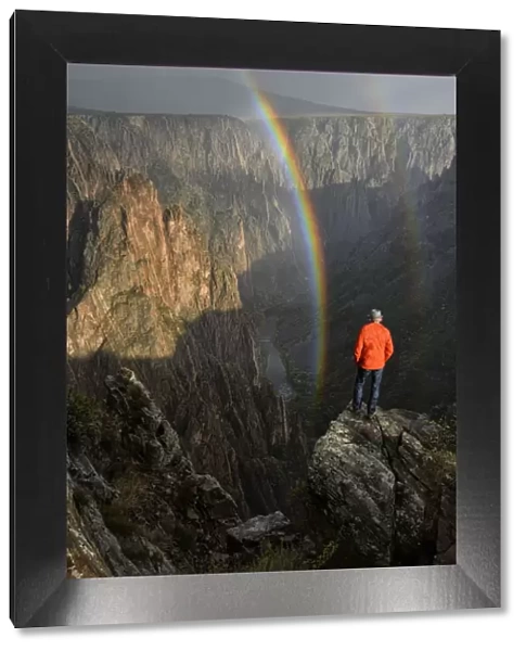 USA, Colorado, Black Canyon of the Gunnison National Park, Man looking into canyon with