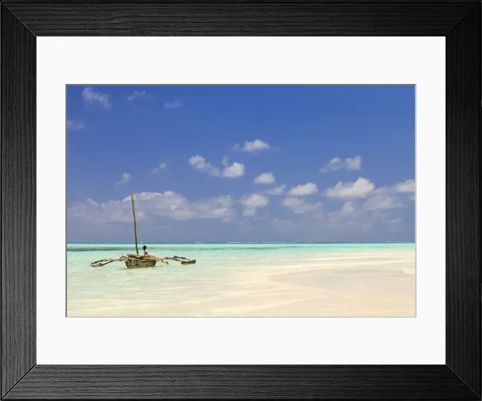 Framed Print : Tanzania, Zanzibar, Unguja, Jambiani. A man sits on his boat Framed Print : Tanzania, Zanzibar, Unguja, Jambiani. A man sits on his boat