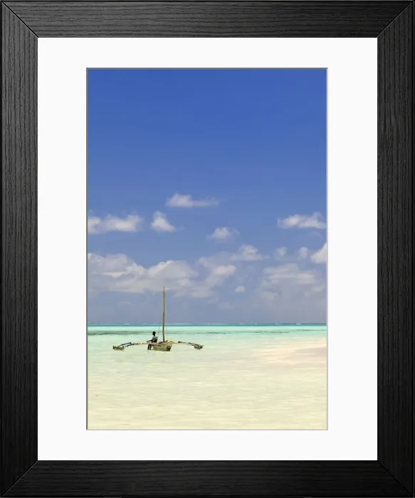 Framed Print : Tanzania, Zanzibar, Unguja, Jambiani. A man sits on his boat Framed Print : Tanzania, Zanzibar, Unguja, Jambiani. A man sits on his boat