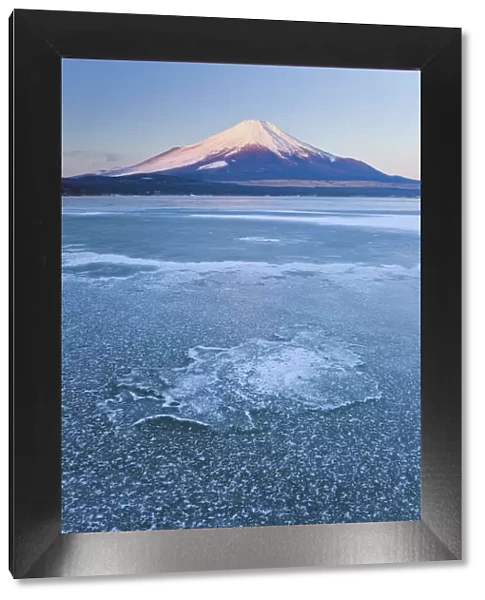 Ice on Lake Yamanaka with snowcovered Mount Fuji in background, Japan
