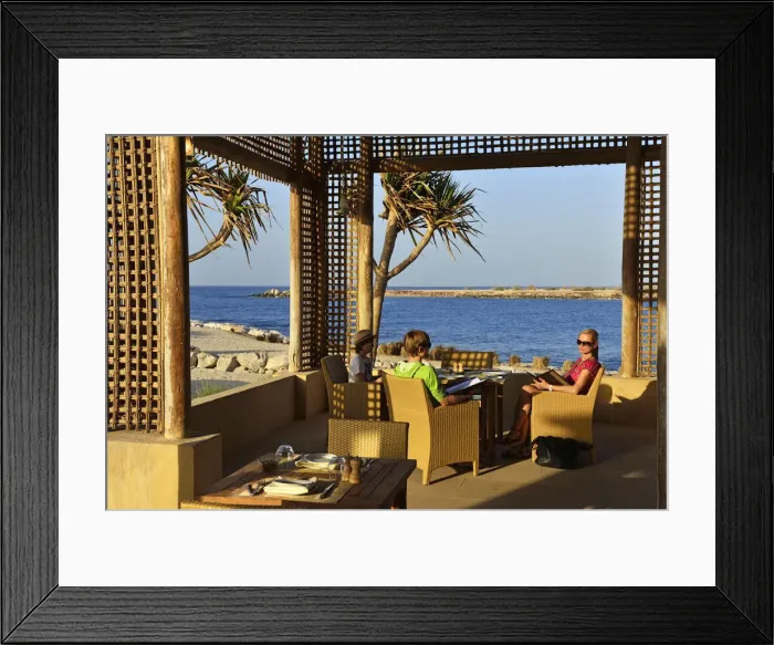 Framed Print : Family dining at the Anantara Desert Island Resort, Sir Bani Yas Island, Abu Dhabi Framed Print : Family dining at the Anantara Desert Island Resort, Sir Bani Yas Island, Abu Dhabi