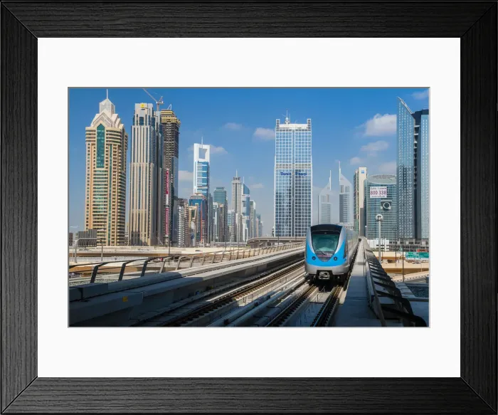 Framed Print : Metro train with city skyline in the background, Dubai, United Arab Emirates