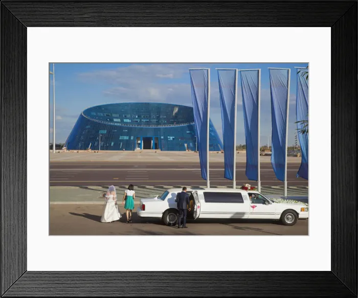 Framed Print : Kazakhstan, Astana, Shabyt Palace of Arts, Wedding party arrive opposite Palace in Framed Print : Kazakhstan, Astana, Shabyt Palace of Arts, Wedding party arrive opposite Palace in